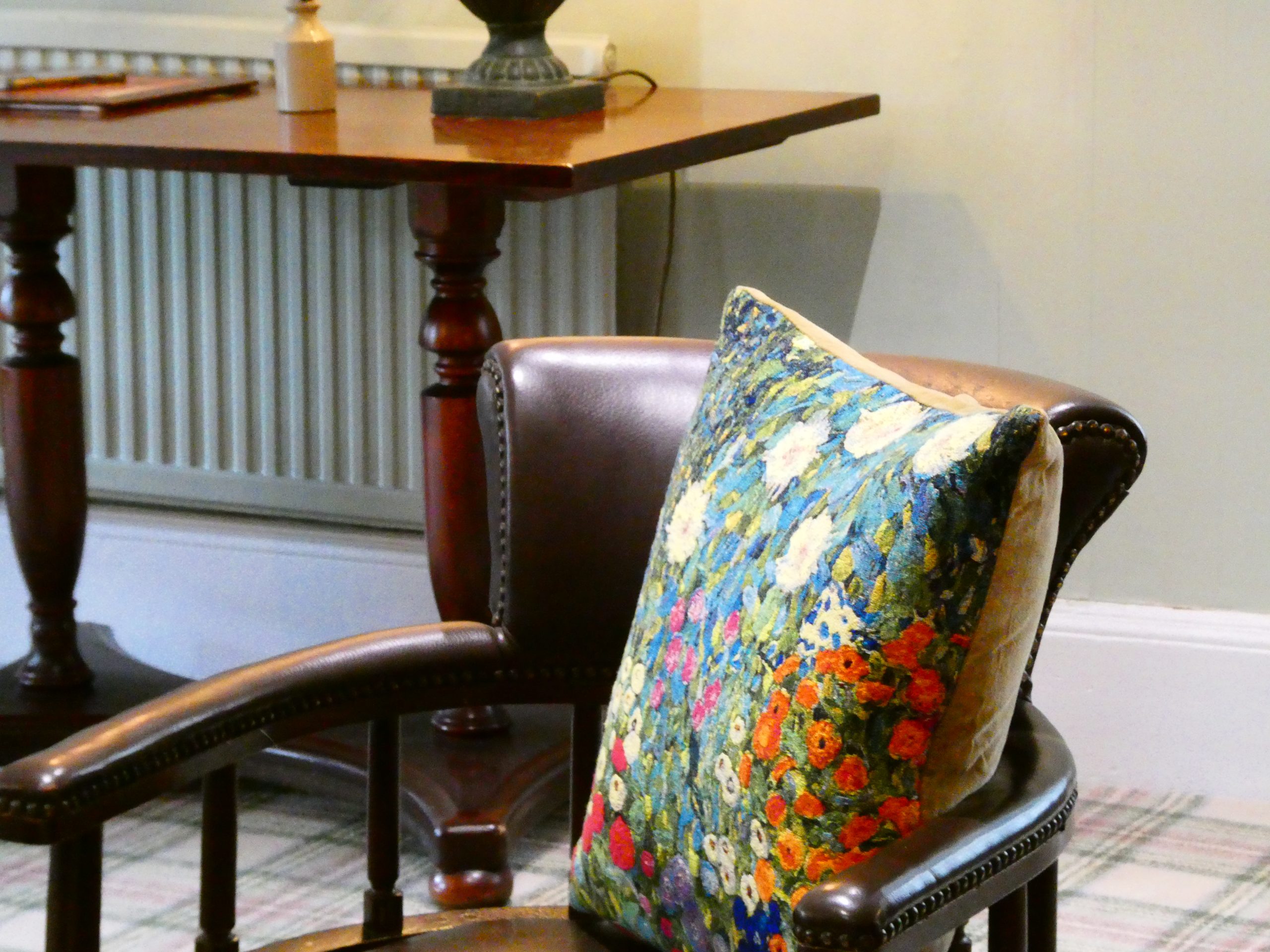 Photo: leather armchair with cushion, for Hotel Amenities banner